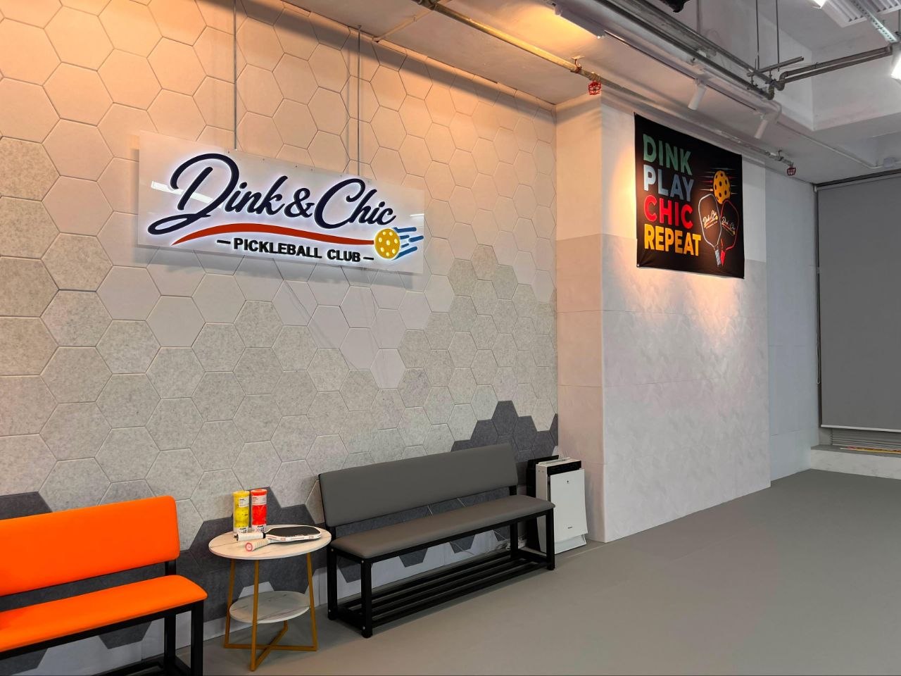 Bench seating and the club wall by the entrance