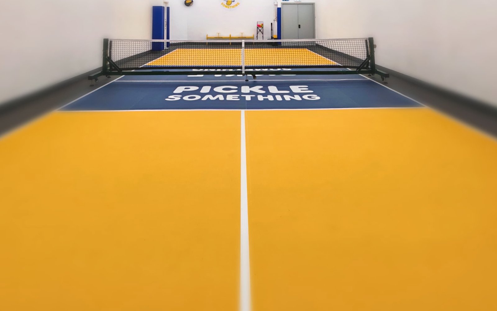 The yellow and navy court from the baseline