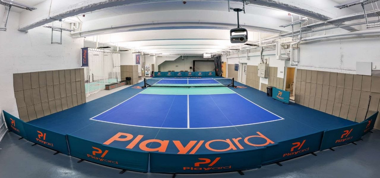 Full court and padded surround from behind the baseline