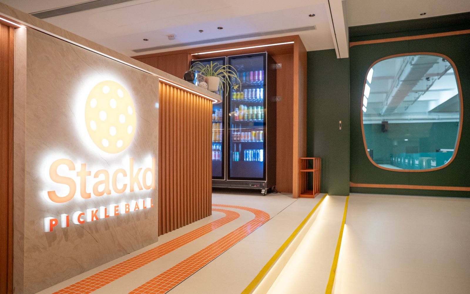 The 8/F front desk, with a porthole window onto the courts