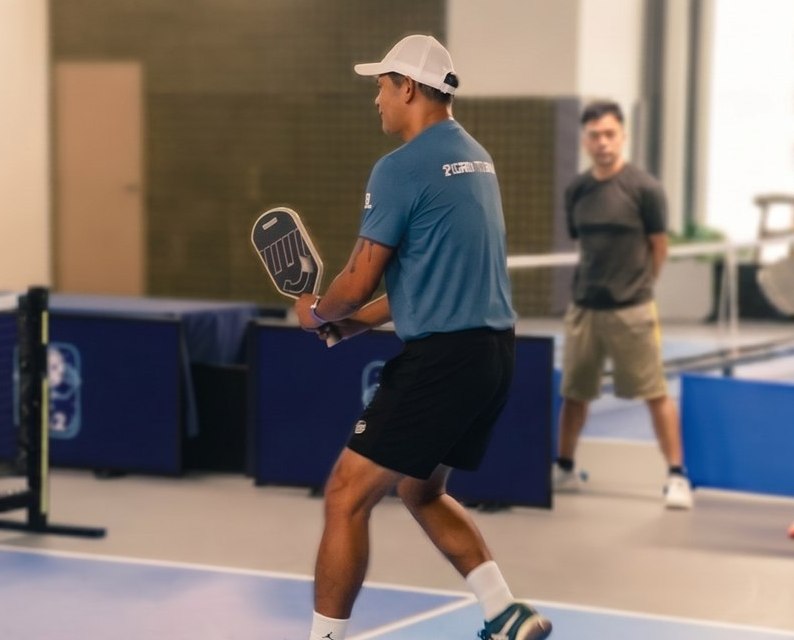 Bobby Armillo, DinkStart featured coach, mid-dink at the net