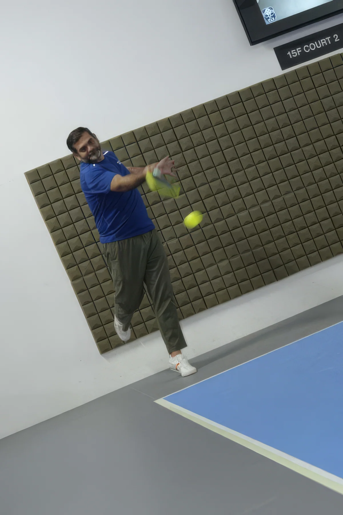 212HK founder Naveed Khawaja playing pickleball on court